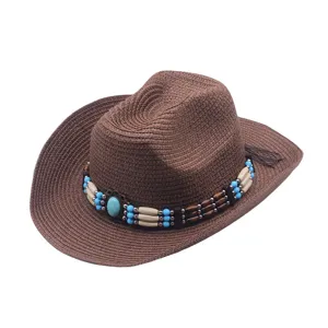Chapeau de cowboy en paille marron avec bande de perles turquoise pour l'été et la plage.