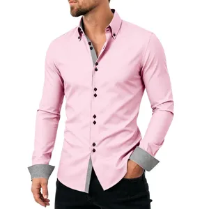 Close-up detail of men's pink long sleeve shirt with contrast geometric collar and cuffs.