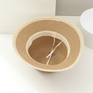 Women's summer straw hat detail view, stylish woven sun hat with inner sweatband and wind rope.
