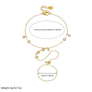 Gold stainless steel finger bracelet detail showing chain links, sparkling zircon stones and size.