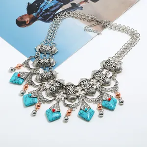 Exaggerated retro statement necklace with turquoise stones, vintage silver alloy and tassels.