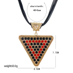 Exaggerated black cord statement necklace with a large crystal rhinestone triangle pendant.
