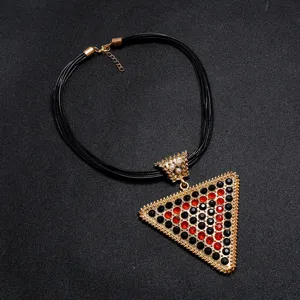 Exaggerated leather cord necklace featuring a large rhinestone triangle pendant and pearl accents for women.