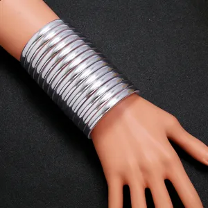 Wide silver layered bangles cuff bracelet stack, bold ethnic style fashion arm jewelry.