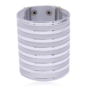 Wide silver PU leather cuff bracelet with glitter stripes and snap button closure for women.