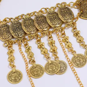 Gold tone vintage coin tassel waist chain detail shot showcasing intricate metal carving and multi-layer links.