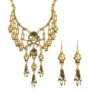 Elegante conjunto de collar y pendientes con borlas de calavera vintage joyería gótica.