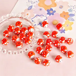 Red polka dot smiling face glass beads, ideal for DIY handmade earrings and jewelry accessories.