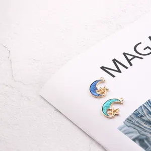 Detail shot of star and moon enamel alloy pendant, diy earring jewelry making material.