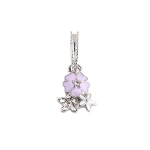 Detailed view of the silver-plated flower charm pendant with pink enamel and sparkling rhinestones.