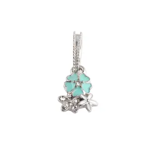 Silver charm pendant featuring mint and white enamel flowers with sparkling rhinestones.