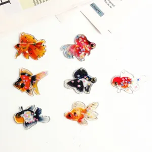 Ciondoli di pesce rosso in resina trasparente con stelle glitterate per orecchini fai te