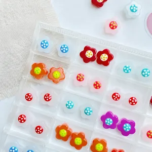 Close-up detail of colorful resin flower beads, perfect for DIY jewelry making and crafts.