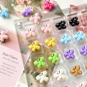 Close-up of colorful butterfly beads and charms in clear organizer box, DIY jewelry making.