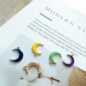 Close-up of colorful enameled moon pendants, alloy diy jewelry charms making accessories.