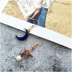 Gold-plated alloy star and moon earrings with pearl pendant, stylish jewelry accessory.