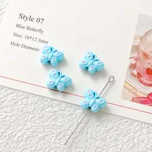 Blue butterfly charm DIY bead detail showing compact alloy size and hole diameter.