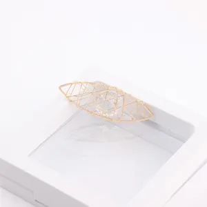 Close-up detail of DIY copper wire wrapped zircon geometric jewelry accessory charm pendant.