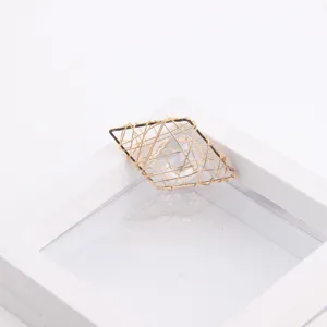 Close up view of geometric rhombus copper wire wrapped zircon DIY jewelry pendant accessory component.