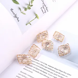 DIY diamond-shaped wire-wrapped crystal charm detail, perfect for handmade jewelry and earrings.