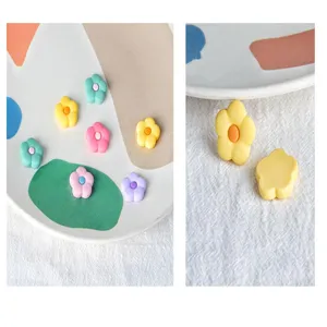 Colorful PVC flower cabochon flatbacks for DIY handmade hair accessories and jewelry crafting.