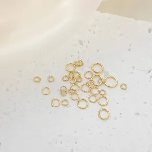 Detail view of 18K gold plated jump rings, essential DIY jewelry making and connecting findings.
