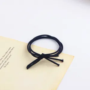 Minimalist black elastic hair tie, soft fabric hair band for daily ponytail styling detail.