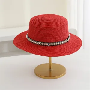 Zomerse Franse elegante strooien hoed voor dames, modieuze parel strand zonnehoed stijl.