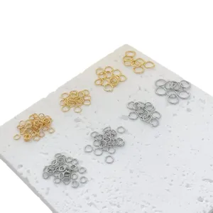 Metal jump rings in gold and silver colors, assorted sizes for DIY jewelry making supplies.
