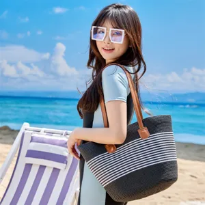Detail view of a striped beach tote bag for women, large capacity woven shoulder bag for summer.
