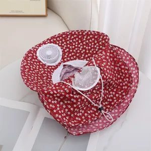 Detail view of the red floral sun hat featuring a built-in electric fan and breathable mesh.