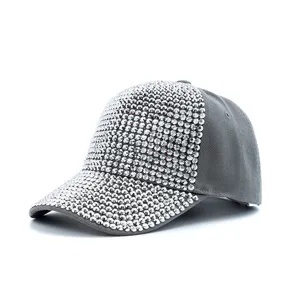 Close-up detail of grey baseball cap with stunning full rhinestone brim and front panels.