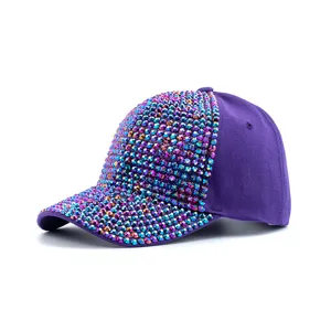 Detailed close-up of a stunning purple rhinestone baseball cap with sparkling colorful crystals.
