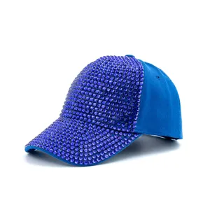 Detailed view of the stylish blue rhinestone baseball cap, highlighting sparkling crystals and fabric.