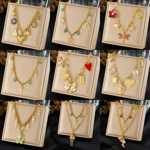 Gold plated stainless steel multi-layer necklace set featuring Egyptian pharaoh, ankh, and heart pendants.