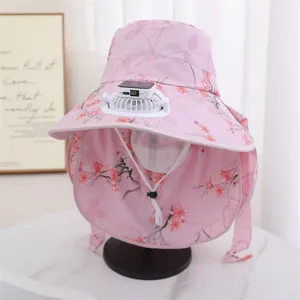 Detail view of the pink floral sun hat with built-in solar rechargeable fan for outdoor use.