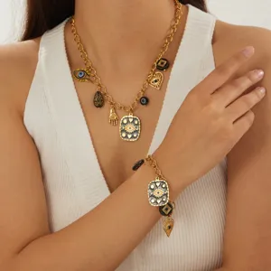 Gold stainless steel evil eye charm necklace and bracelet set for women fashion jewelry.