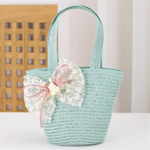 Bolso tejido para niños bolsa de paja verde claro con dulce lazo de encaje para niñas pequeñas.