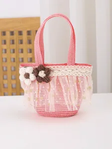 Cute pink straw handbag for kids, beautifully decorated with crochet flowers, lace and mesh trim.