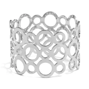 Silver metal napkin ring with creative hollow geometric circle design for elegant table decor.