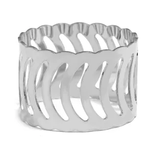Silver metal napkin ring with hollow wave design, elegant table setting accessory detail view.