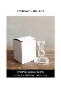 Detail view of clear vertical stripe glass candle holder with white packaging box on wooden table.