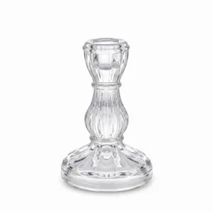 Clear glass candlestick holder for romantic dinners, weddings, and home decor desktop display.