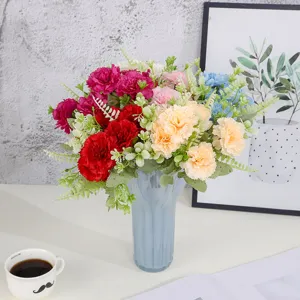 Artificial colorful carnation bouquet in blue vase, ideal for home decor and festival gifts.