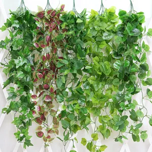Artificial hanging green plant vines detail view, silk leaves wall decor for home and fence.