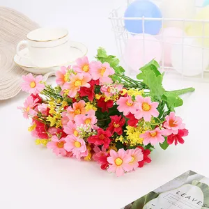 Detailed view of artificial pink and red daisy flower bouquet for home decor and party.