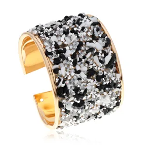 Brazalete abierto ancho dorado de moda, incrustado con relucientes piedras de cristal blanco y negro.