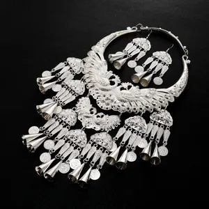 Exaggerated vintage silver peacock torque necklace and earrings set ethnic costume jewelry.