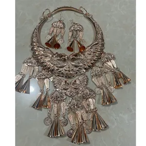 Exaggerated retro peacock collar necklace and earrings set, detailed metallic bell pendants.