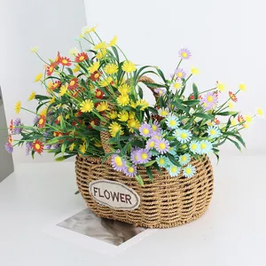 Artificial daisy flowers in woven basket for home decor, colorful fake floral arrangement.